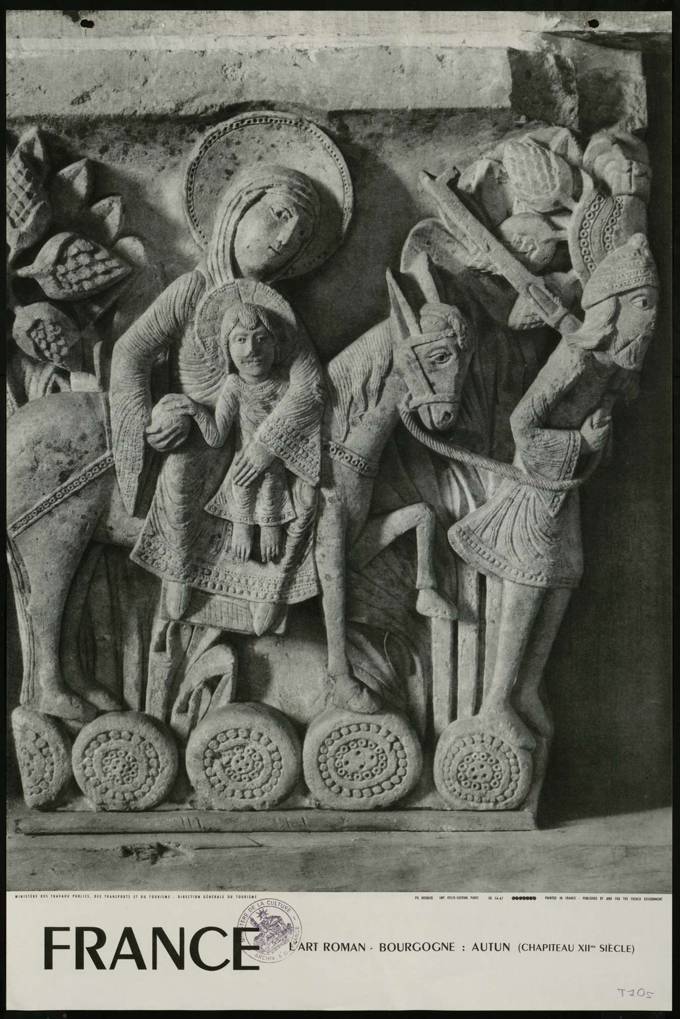 Une affiche en noir et blanc contenant la photo d'une sculpture représentant la fuite de Joseph, Marie et Jésus en Egypte occupe les deux tiers de l'affiche, le mot "France" apparaît en dessous en grandes lettres capitales puis en plus petit est inscrit "l'art roman - Bourgogne - Autun, 12ème siècle, direction générale du tourisme"