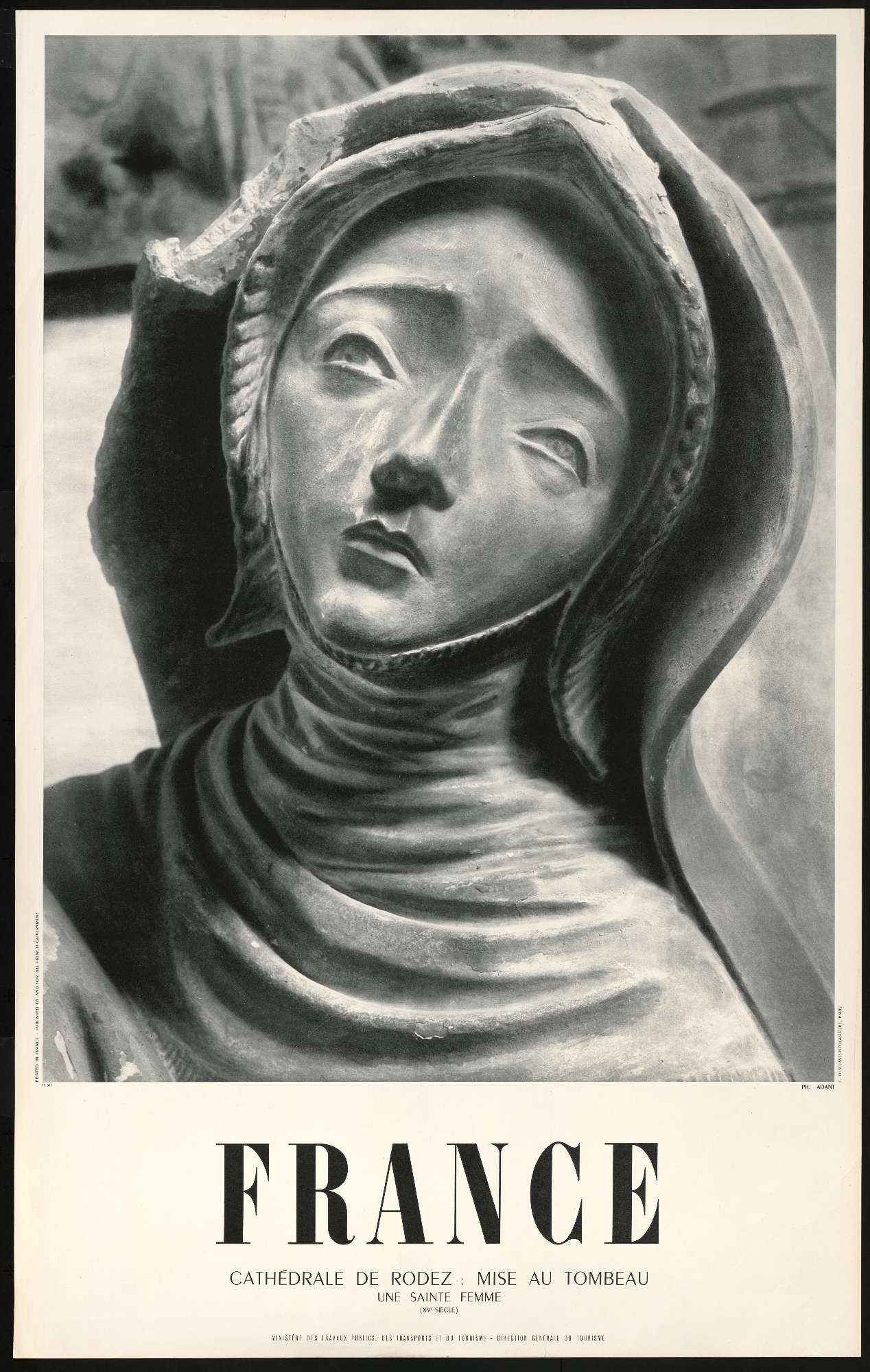 Une affiche en noir et blanc contenant la photo du visage d'une sculpture d'une nonne catholique occupe les deux tiers de l'affiche, le mot "France" apparaît en dessous en grandes lettres capitales puis en plus petit est inscrit "cathédrale de Rodez, 15ème siècle, direction générale du tourisme"